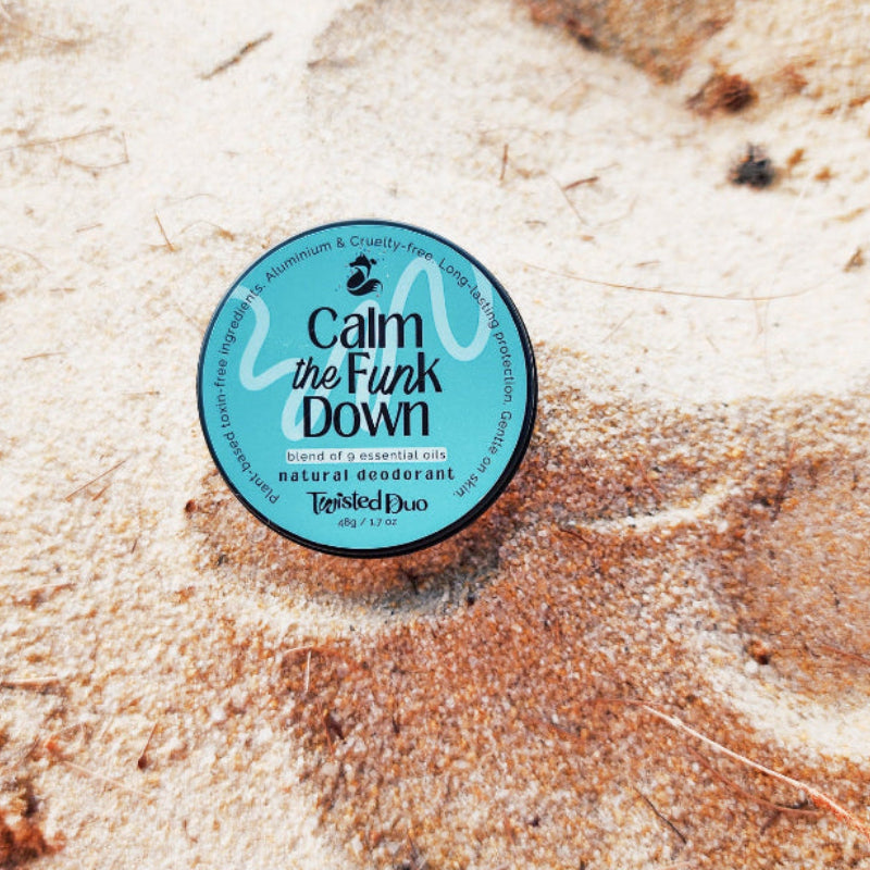 natural deodorant Calm the Funk Down on a beach