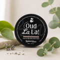natural deodorant jar 'Oud La La' with green plants